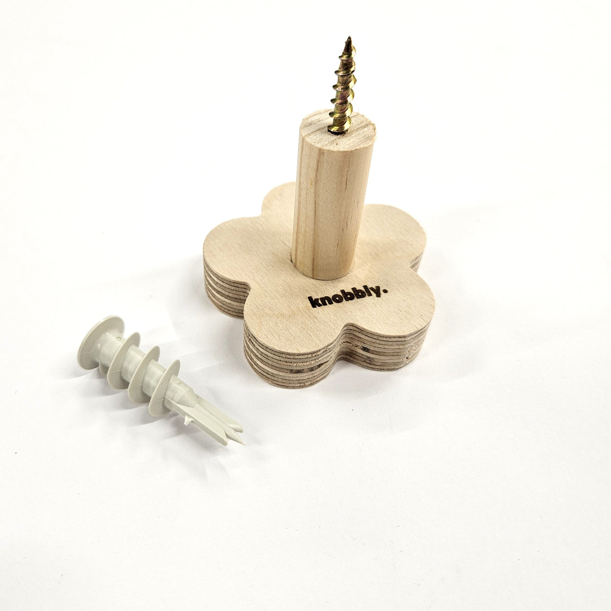 Wooden wall hook with screws on a white background, branded 'knobbly'.