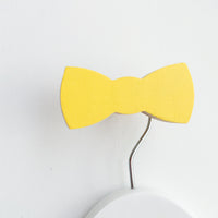 knobbly. bow tie wall hook yellow