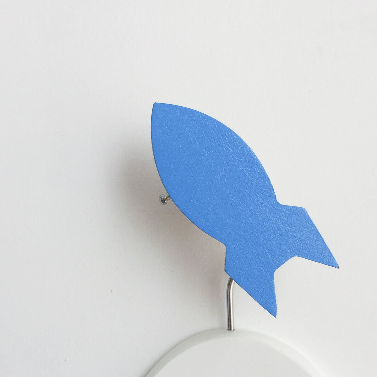 knobbly. rocket wall hook pop of blue